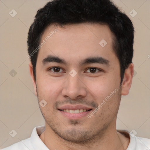 Joyful white young-adult male with short  black hair and brown eyes