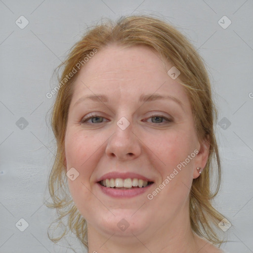 Joyful white young-adult female with medium  brown hair and blue eyes