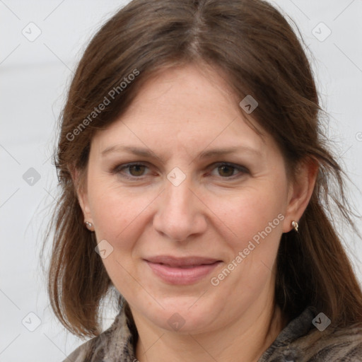 Joyful white adult female with medium  brown hair and grey eyes