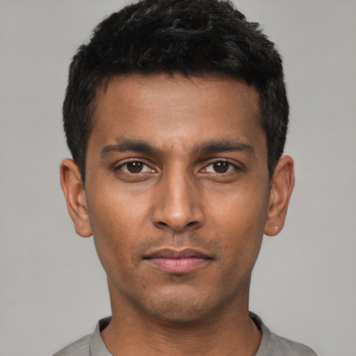 Neutral latino young-adult male with short  black hair and brown eyes