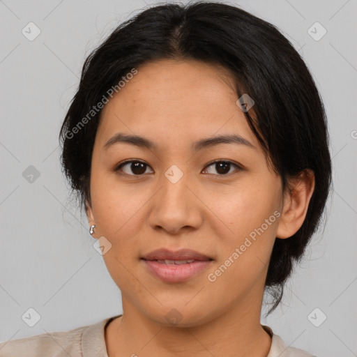 Joyful asian young-adult female with short  brown hair and brown eyes