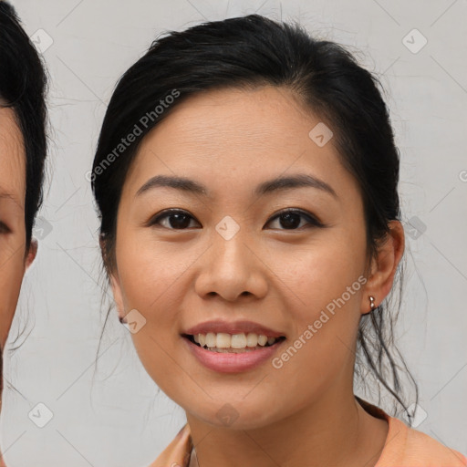 Joyful asian young-adult female with medium  brown hair and brown eyes