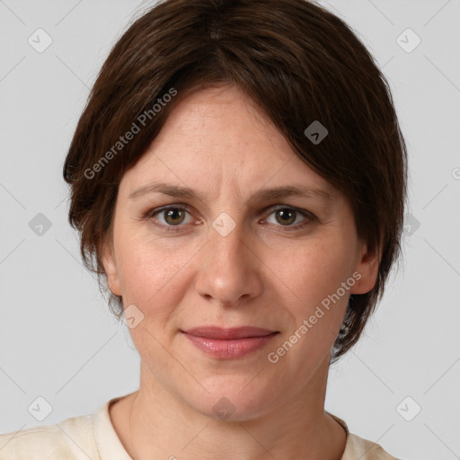 Joyful white adult female with medium  brown hair and grey eyes