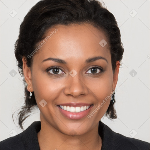 Joyful black young-adult female with medium  brown hair and brown eyes