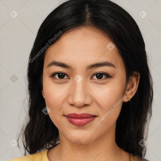 Joyful latino young-adult female with medium  black hair and brown eyes