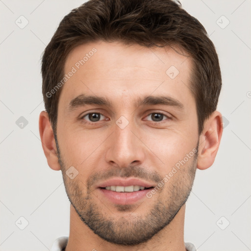 Joyful white young-adult male with short  brown hair and brown eyes