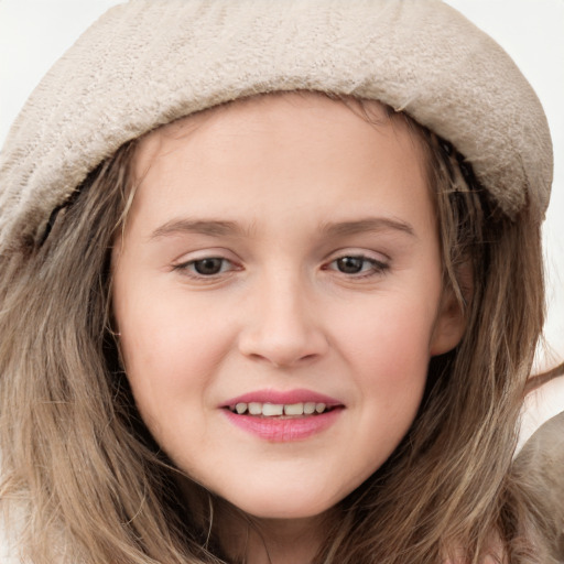 Joyful white child female with long  brown hair and grey eyes