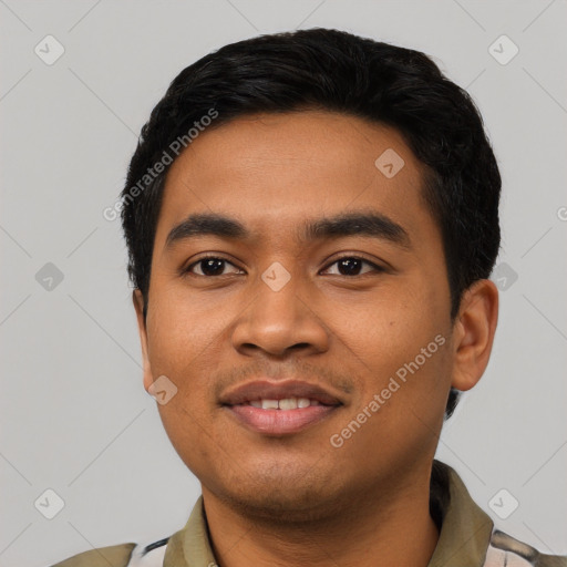 Joyful asian young-adult male with short  black hair and brown eyes