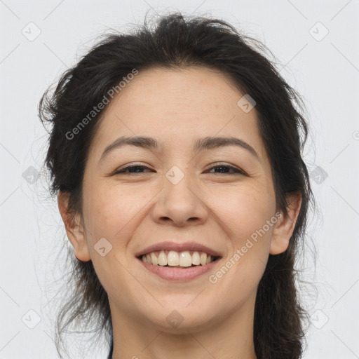 Joyful white adult female with long  brown hair and brown eyes