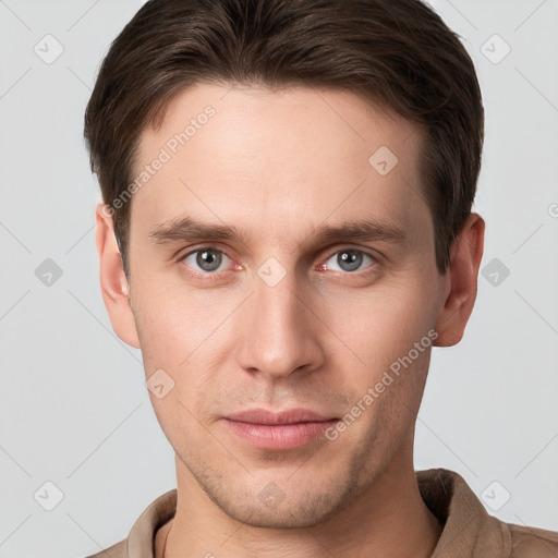 Neutral white young-adult male with short  brown hair and grey eyes