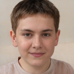 Joyful white child male with short  brown hair and brown eyes