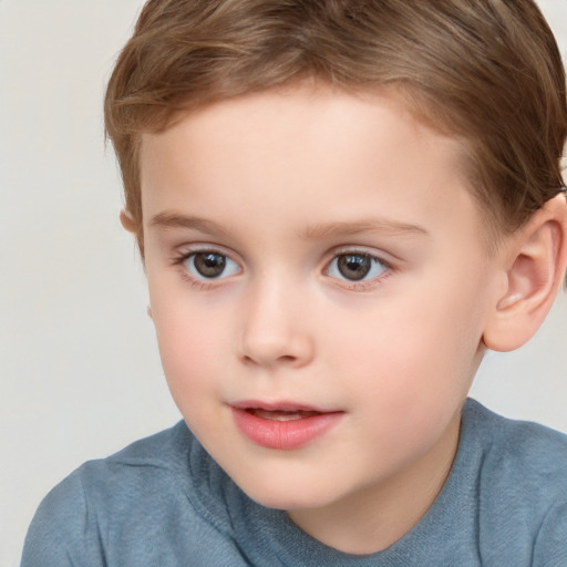 Joyful white child male with short  brown hair and brown eyes