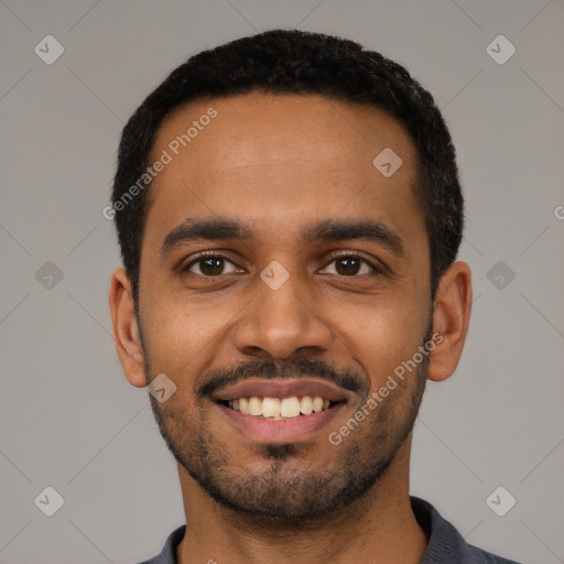 Joyful black young-adult male with short  black hair and brown eyes