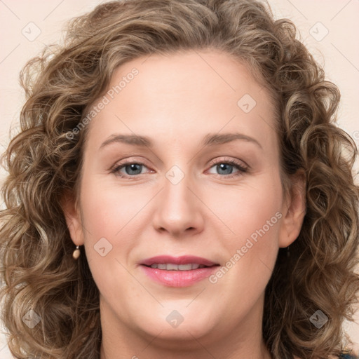 Joyful white young-adult female with long  brown hair and green eyes