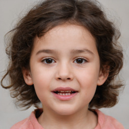Joyful white child female with medium brown hair and brown eyes