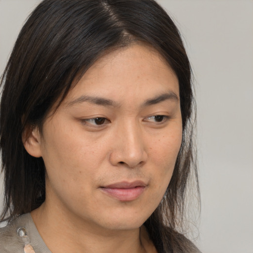 Neutral asian young-adult female with medium  brown hair and brown eyes