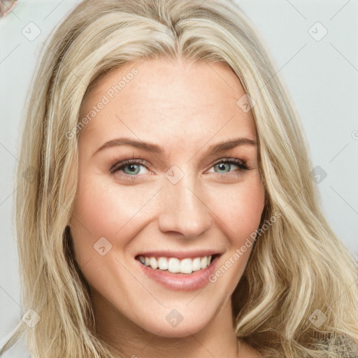 Joyful white young-adult female with long  brown hair and green eyes