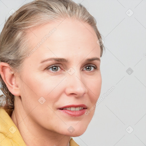 Joyful white young-adult female with medium  brown hair and blue eyes