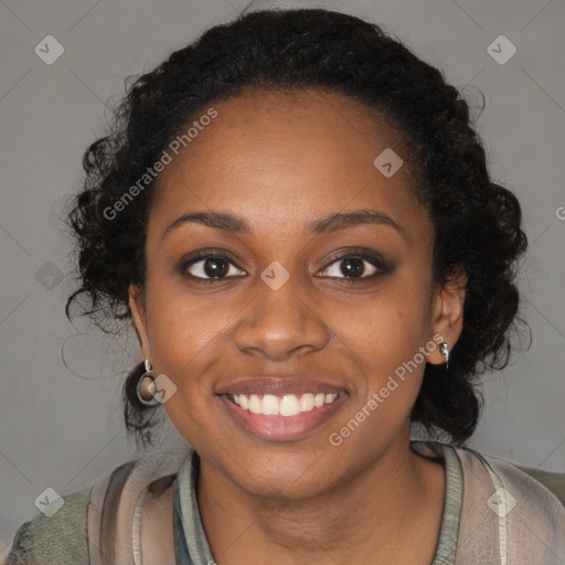 Joyful black young-adult female with long  brown hair and brown eyes