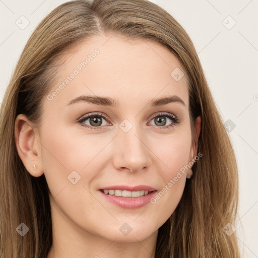 Joyful white young-adult female with long  brown hair and blue eyes