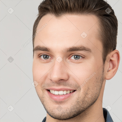 Joyful white young-adult male with short  brown hair and brown eyes