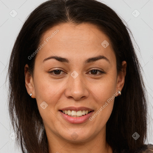 Joyful latino adult female with long  brown hair and brown eyes