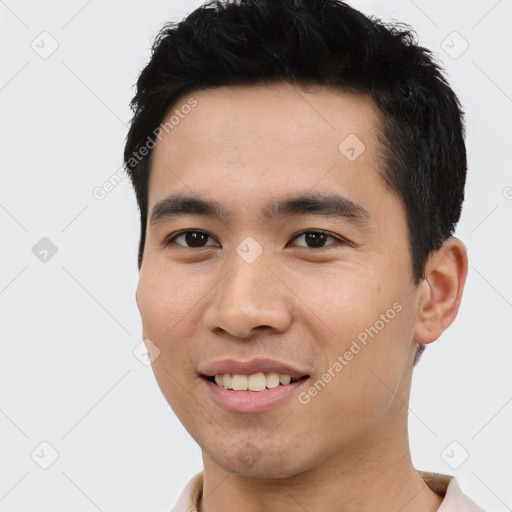 Joyful asian young-adult male with short  black hair and brown eyes