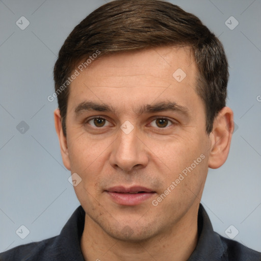 Joyful white adult male with short  brown hair and brown eyes