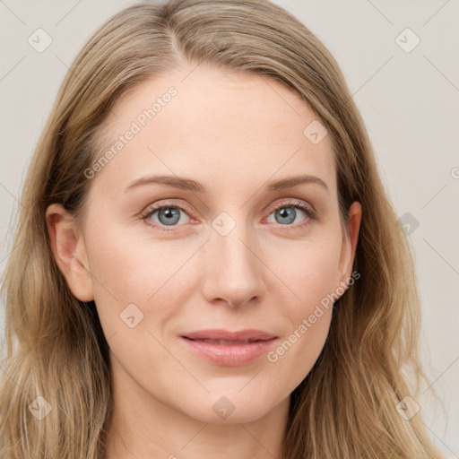 Joyful white young-adult female with long  brown hair and blue eyes