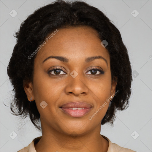 Joyful black adult female with medium  brown hair and brown eyes