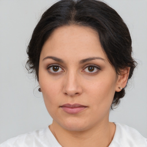Neutral white young-adult female with medium  brown hair and brown eyes