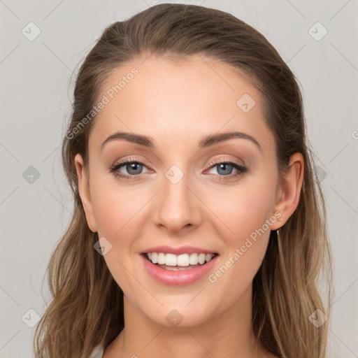 Joyful white young-adult female with long  brown hair and grey eyes