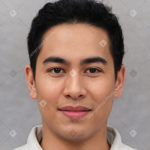 Joyful latino young-adult male with short  brown hair and brown eyes