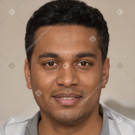 Joyful black young-adult male with short  black hair and brown eyes