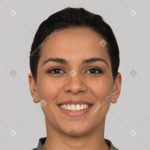 Joyful latino young-adult female with short  black hair and brown eyes