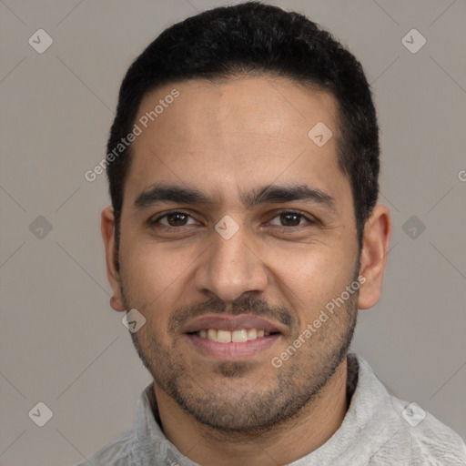 Joyful latino young-adult male with short  black hair and brown eyes