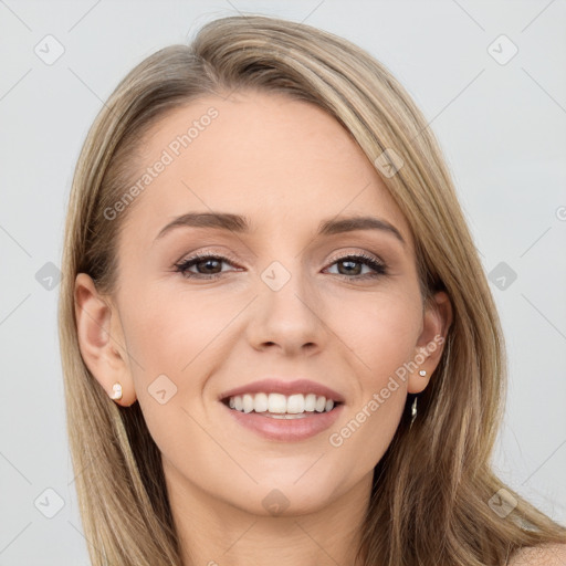 Joyful white young-adult female with long  brown hair and blue eyes