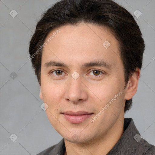 Joyful white adult male with short  brown hair and brown eyes