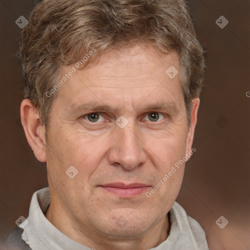 Joyful white middle-aged male with short  brown hair and brown eyes