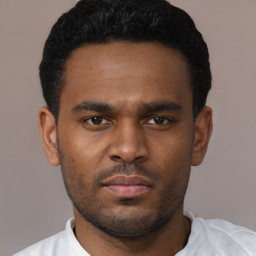 Neutral black young-adult male with short  black hair and brown eyes