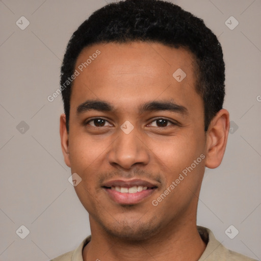 Joyful latino young-adult male with short  black hair and brown eyes