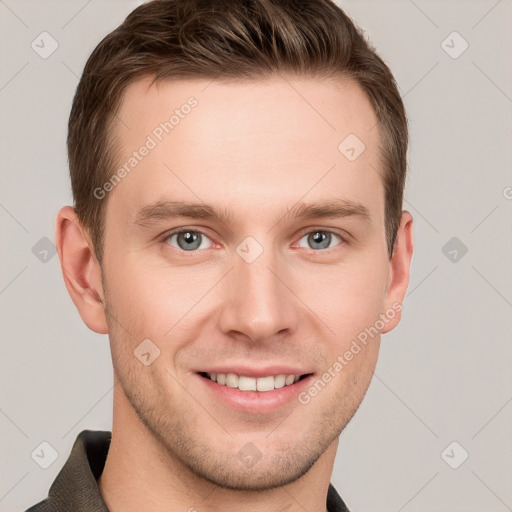 Joyful white young-adult male with short  brown hair and grey eyes