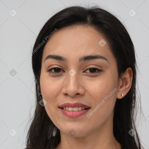 Joyful latino young-adult female with long  brown hair and brown eyes