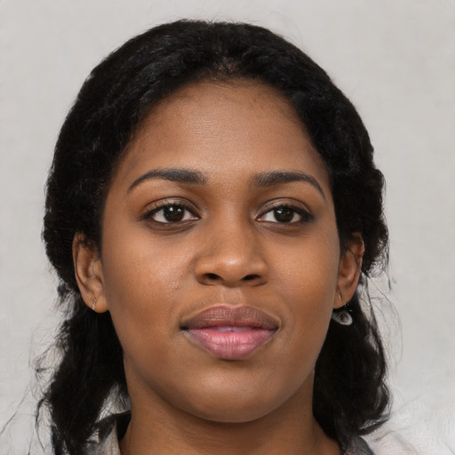 Joyful black young-adult female with medium  black hair and brown eyes
