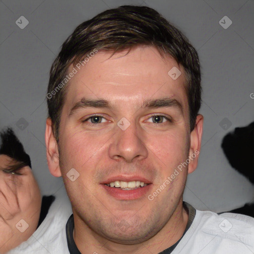 Joyful white adult male with short  brown hair and brown eyes