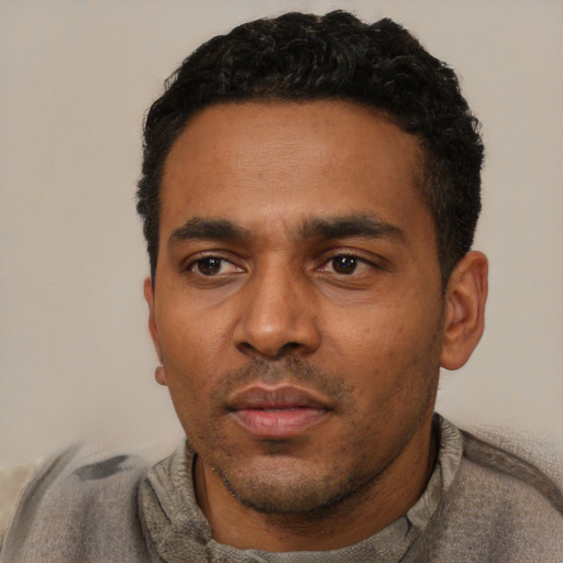 Neutral latino adult male with short  black hair and brown eyes