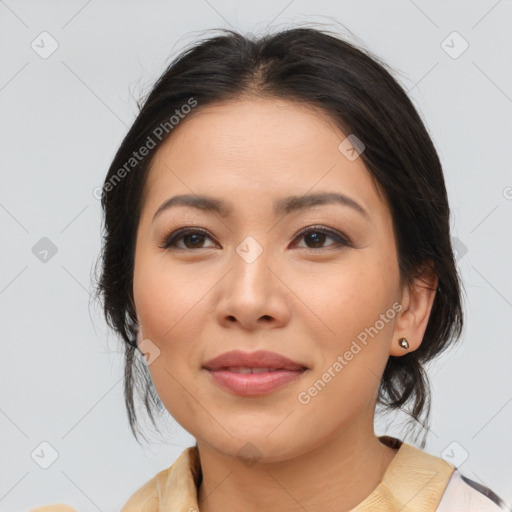 Joyful latino young-adult female with medium  brown hair and brown eyes