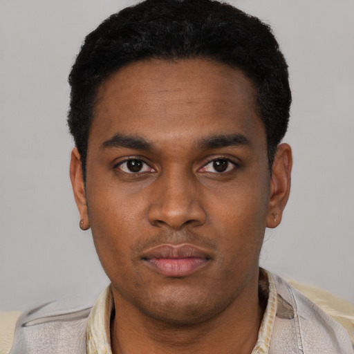 Neutral latino young-adult male with short  black hair and brown eyes