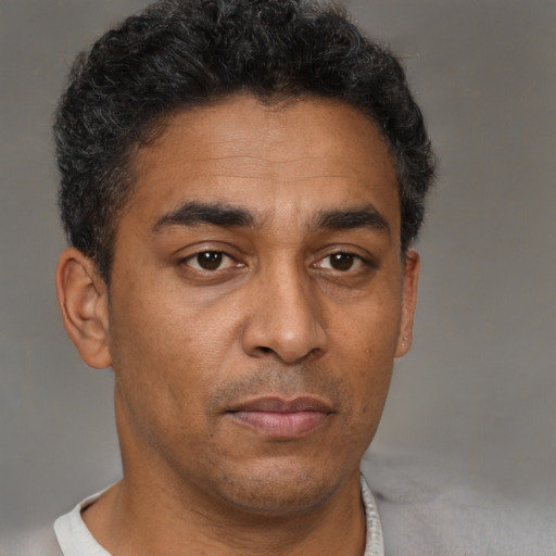 Neutral black young-adult male with short  brown hair and brown eyes