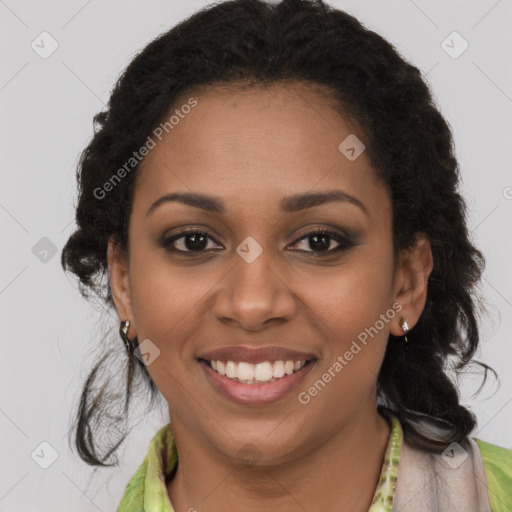 Joyful black young-adult female with long  brown hair and brown eyes